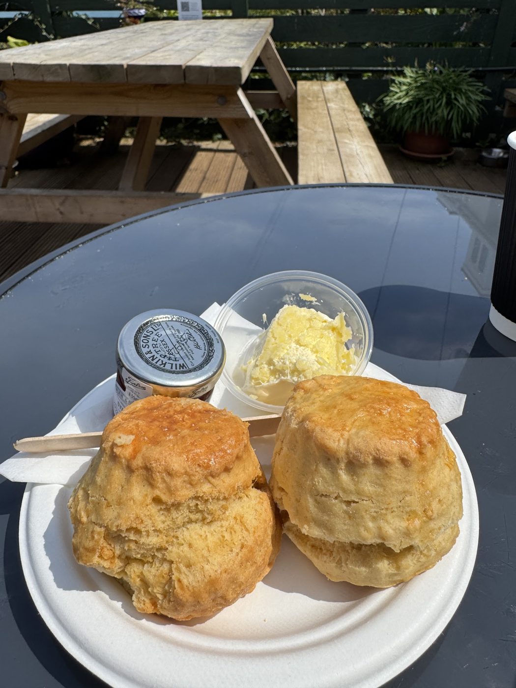 Two scones with jam and cream